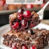 A close-up of a fork holding a bite of chocolate cherry dump cake, featuring a moist, fudgy texture filled with vibrant red cherries. The background shows a slice of the cake on a white plate, highlighting its rich chocolate layers and crackly crust.
