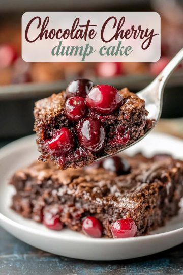 A close-up of a fork holding a bite of chocolate cherry dump cake, featuring a moist, fudgy texture filled with vibrant red cherries. The background shows a slice of the cake on a white plate, highlighting its rich chocolate layers and crackly crust.