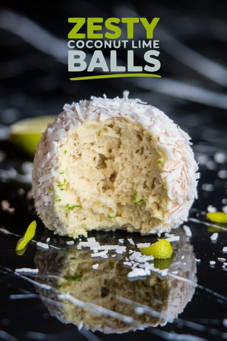 A close-up of a single coconut lime ball with a bite missing. The ball is coated in shredded coconut and lime zest, resting on a glossy black surface. The text overlay reads 