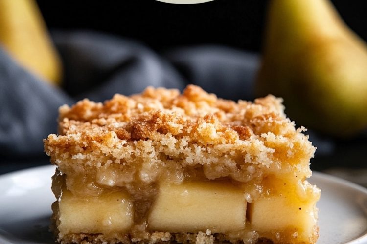 A close-up of a slice of pear dump cake on a white plate, showing layers of soft pears and a crisp, buttery crumb topping. Pears in the background complement the dessert. The text overlay reads "Pear Dump Cake: Pin, Bake, Love."