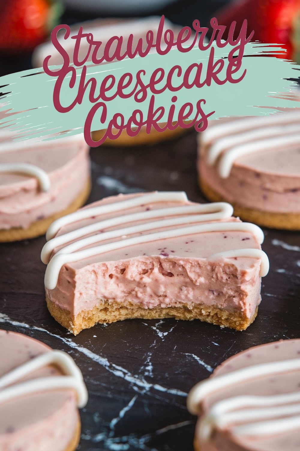 A close-up of a single strawberry cheesecake cookie with a bite taken out, revealing the creamy pink filling and crumbly cookie crust. The icing drizzle and visible strawberry pieces enhance the dessert’s visual appeal, making it an irresistible treat.