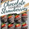 A tray of chocolate-covered strawberries arranged on parchment paper. Each strawberry is dipped in dark chocolate and drizzled with white chocolate. Text overlay reads “Chocolate Covered Strawberries.”
