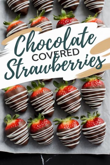 A tray of chocolate-covered strawberries arranged on parchment paper. Each strawberry is dipped in dark chocolate and drizzled with white chocolate. Text overlay reads “Chocolate Covered Strawberries.”