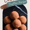 A styled graphic featuring a stack of cocoa-dusted chocolate truffles on a black background, with a text overlay that reads “Chocolate Truffles Recipe.”
