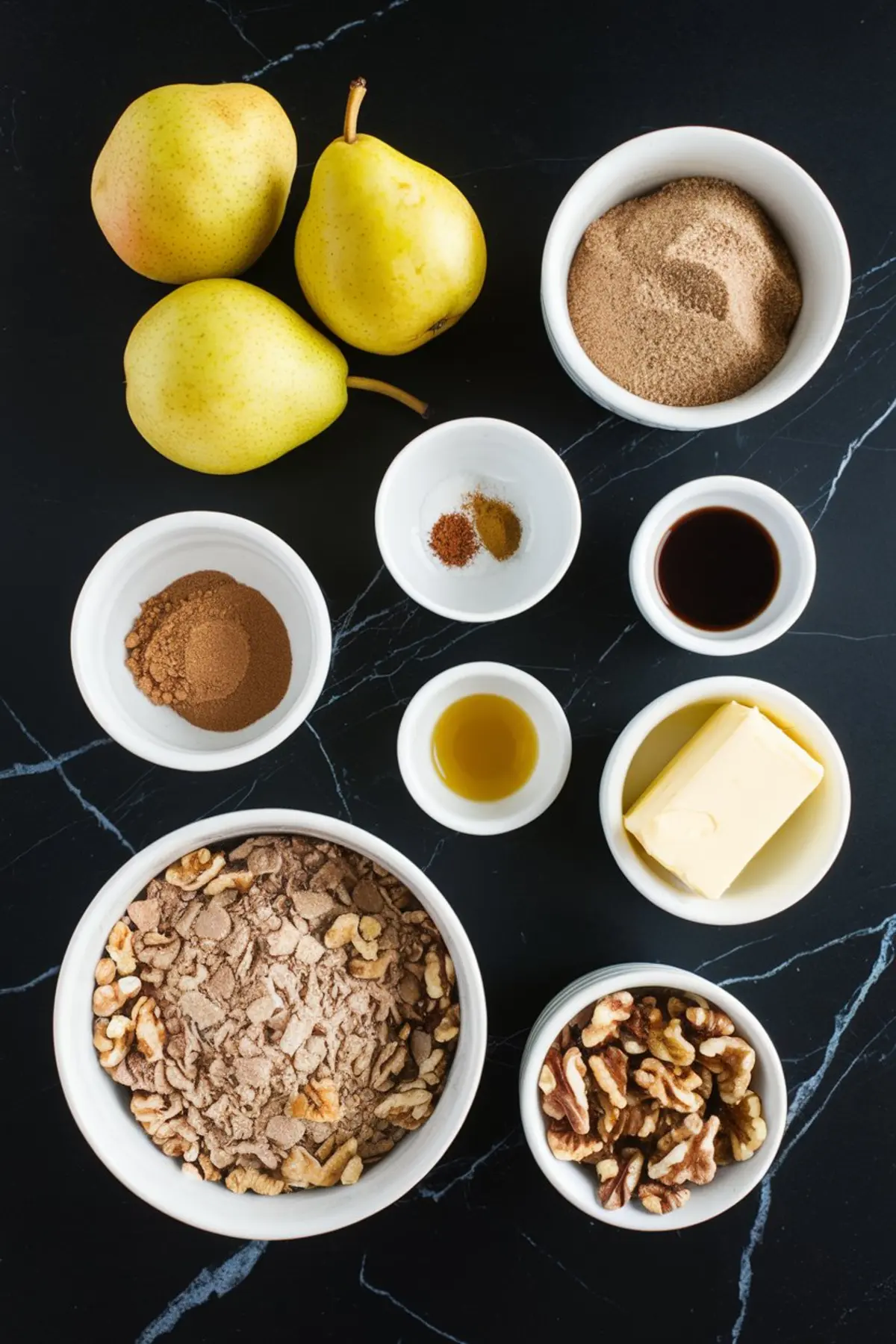 A flat-lay of ingredients for a spiced pear walnut dump cake arranged on a black marble surface. The image includes fresh yellow pears, brown sugar, walnuts, butter, vanilla extract, cinnamon, nutmeg, and cake mix in small white bowls.