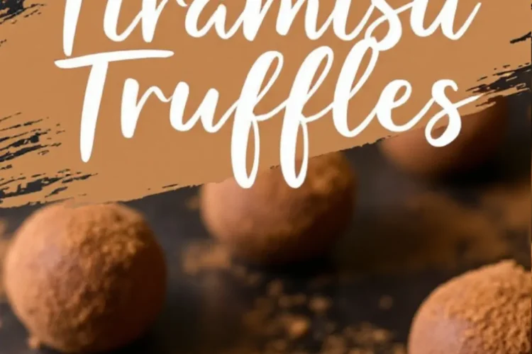 Tiramisu truffles on a dark surface with a rustic cocoa-dusted background. One truffle is bitten into, revealing a soft, creamy interior. A text overlay reads “Tiramisu Truffles” in bold white script, highlighting the dessert’s name.