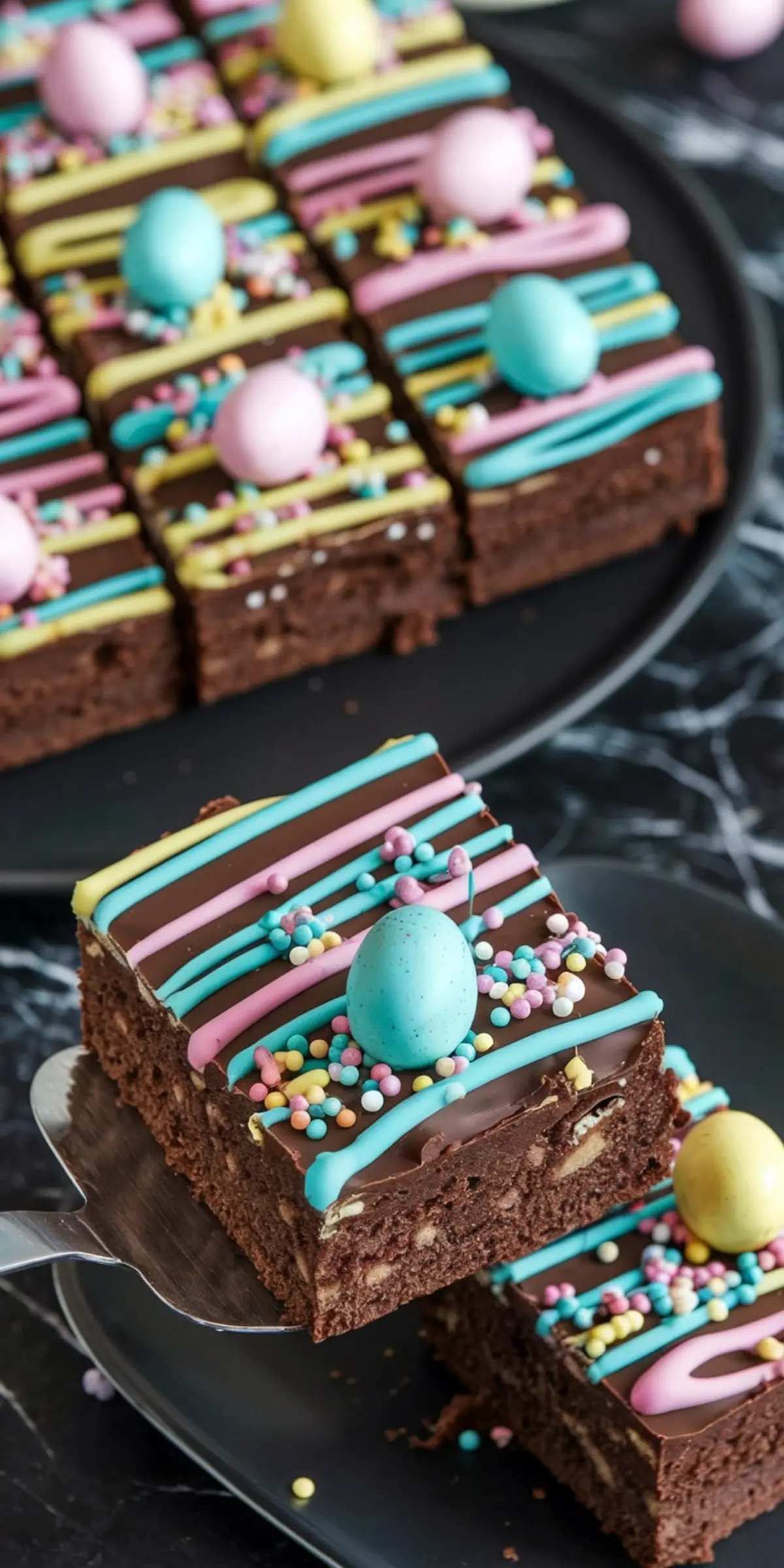 Easter Brownies with Pastel Drizzle and Sprinkles – Fudgy chocolate brownies topped with a glossy chocolate layer, pastel pink, yellow, and blue drizzle, sprinkles, and candy eggs for a colorful and cute Easter dessert.