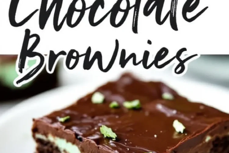 A slice of mint chocolate brownie on a white plate, featuring a fudgy brownie base, a thick layer of mint frosting, and a glossy chocolate ganache topping, garnished with fresh mint leaves. The image includes bold text reading “Mint Chocolate Brownies.”