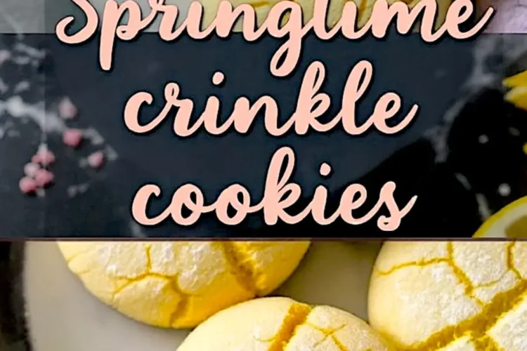 A close-up of a plate with soft, cracked crinkle cookies in pink and yellow, resting on a black marble countertop with crumbs scattered. The text overlay reads “Springtime Crinkle Cookies.”