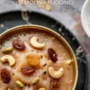 Close-up of suji halwa served in a brass bowl, garnished with golden raisins, cashews, and green cardamom pods. This creamy Indian semolina dessert features a smooth texture and rich ghee glaze, ideal for festive sweets or traditional Indian recipes.