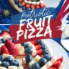 Baked and sliced patriotic fruit pizza decorated with layers of strawberries, bananas, and blueberries over cream cheese frosting, shown overhead and close-up on a white plate with a festive red, white, and blue background.