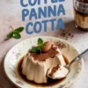 Silky coffee panna cotta partially spooned out on a floral porcelain plate, topped with cocoa, almond, and mint, placed beside a glass of espresso and mint sprig on a blush backdrop.