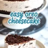 Whole Oreo cheesecake on a white cake stand with a chocolate cookie crust and cookie crumb topping—easy Oreo cheesecake for cookies and cream lovers.