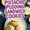 Overhead view of pistachio pudding sandwich cookies arranged on a white plate, surrounded by whole pistachios and scattered cookie pieces on a dark slate surface.