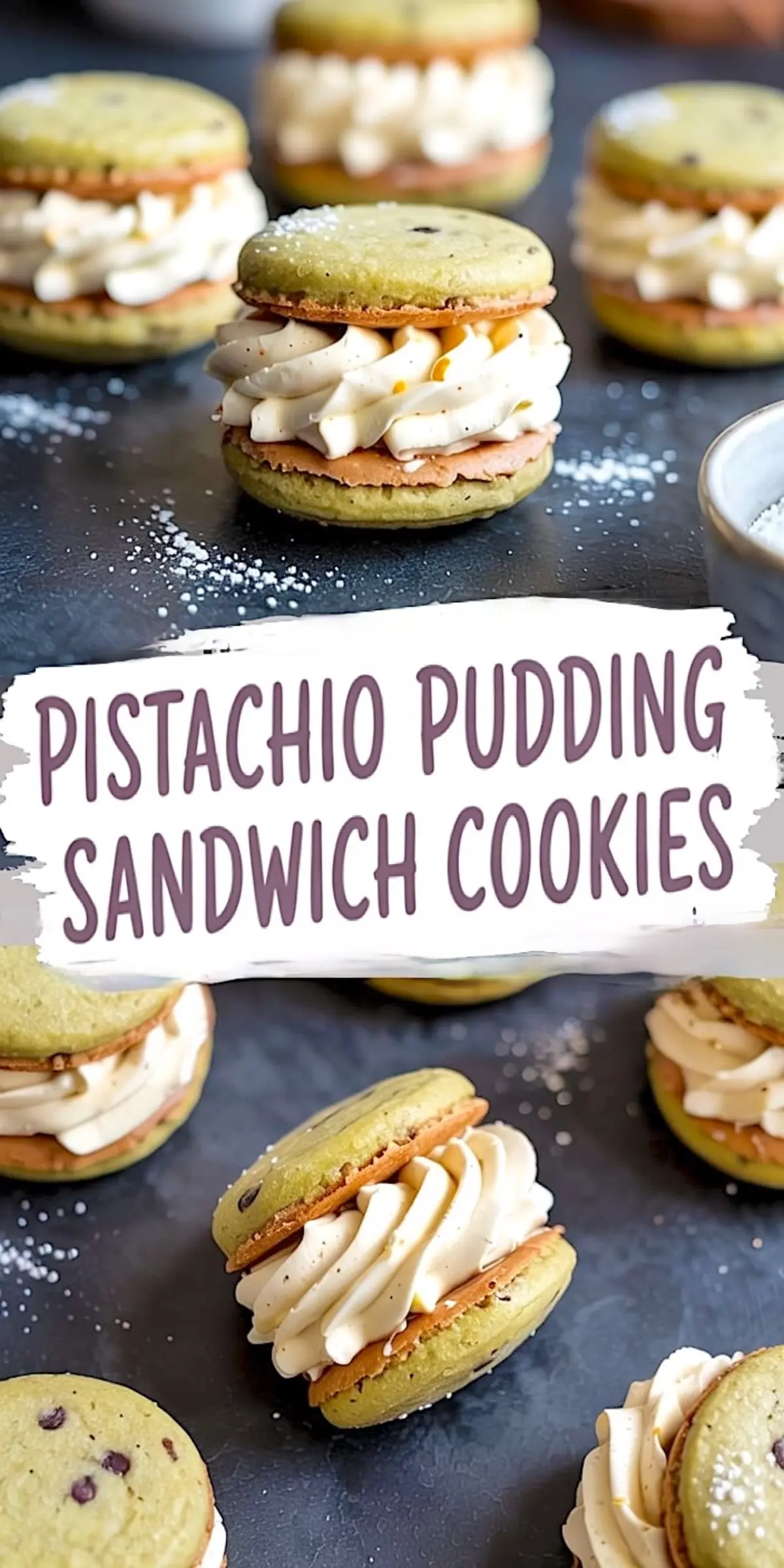 Multiple pistachio pudding sandwich cookies filled with piped vanilla cream, set on a dark surface with a light dusting of powdered sugar and scattered cookie crumbs.
