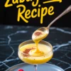 Vertical collage showing zabaglione in a coupe glass with raspberries and cocoa, with bold yellow “Zabaglione Recipe” lettering, ideal for Pinterest boards focused on Italian pastries and desserts.