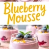 Top and side view of blueberry mousse in glass cups layered with berry compote, decorated with blueberries, orange zest, and mint sprigs, styled against a pink background.