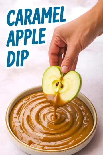 Hand dipping a halved green apple into a bowl of smooth caramel sauce, labeled “Caramel Apple Dip” in bold blue text.