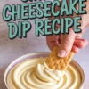 Hand dipping a graham cracker into a bowl of thick, swirled cheesecake dip, set against a soft surface with “Simple Cheesecake Dip Recipe” text overlay in teal font.
