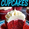 Red velvet cupcake with a bite taken out, revealing its vibrant red interior and moist texture. The creamy swirl of frosting sits atop the rich cupcake on a blue plate.