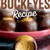 Close-up of homemade buckeyes candy with a bite taken out, showing creamy peanut butter filling inside a chocolate coating, displayed with text “Homemade Buckeyes Recipe.”