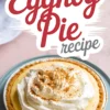 Whole eggnog pie topped with whipped cream and sprinkled with ground cinnamon, served in a foil pie pan with a graham cracker crust, and labeled “Eggnog Pie Recipe.”