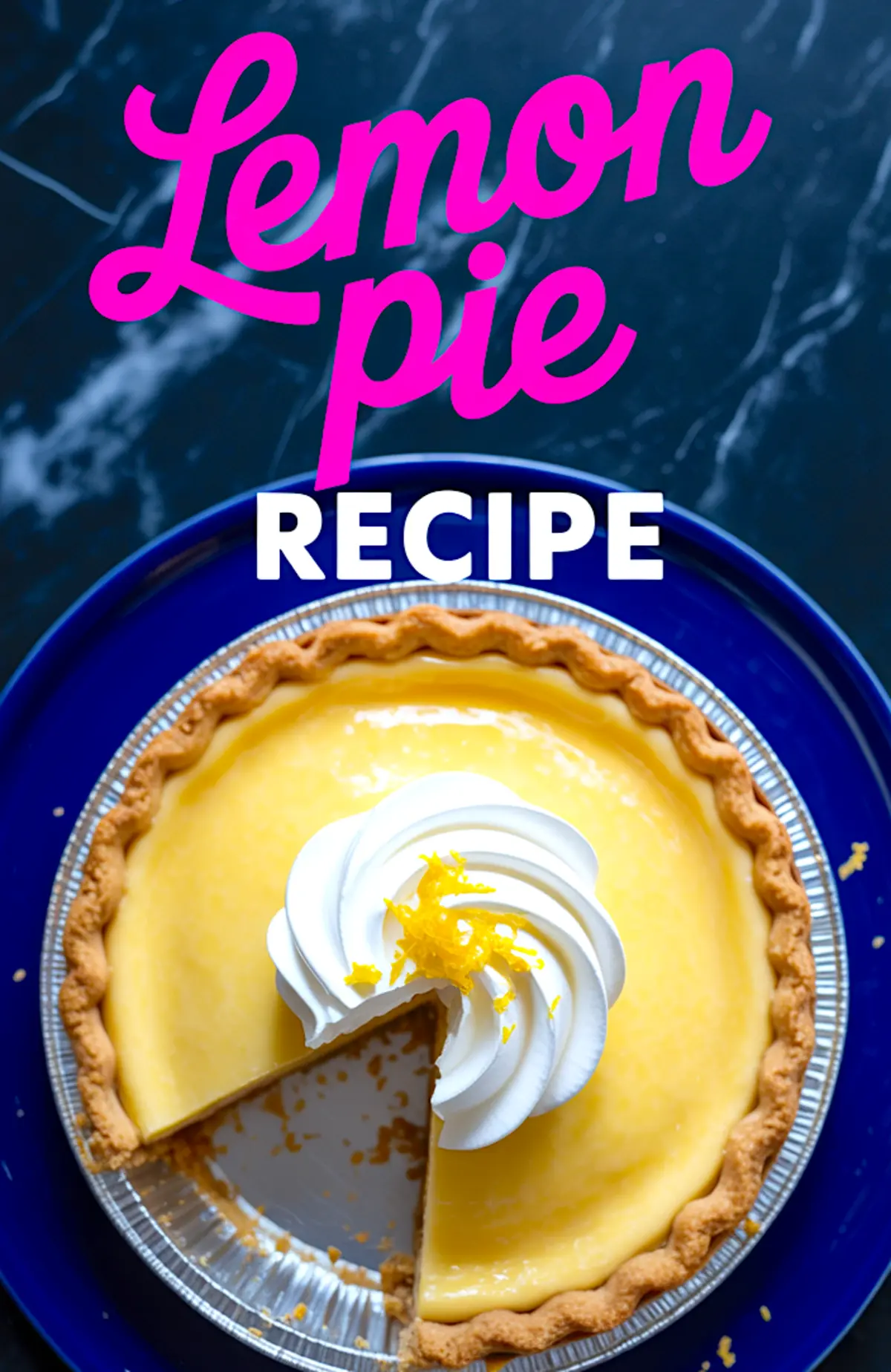 Overhead view of a whole lemon pie with whipped topping and lemon zest, placed in a foil pie dish on a dark marble surface with one slice removed.