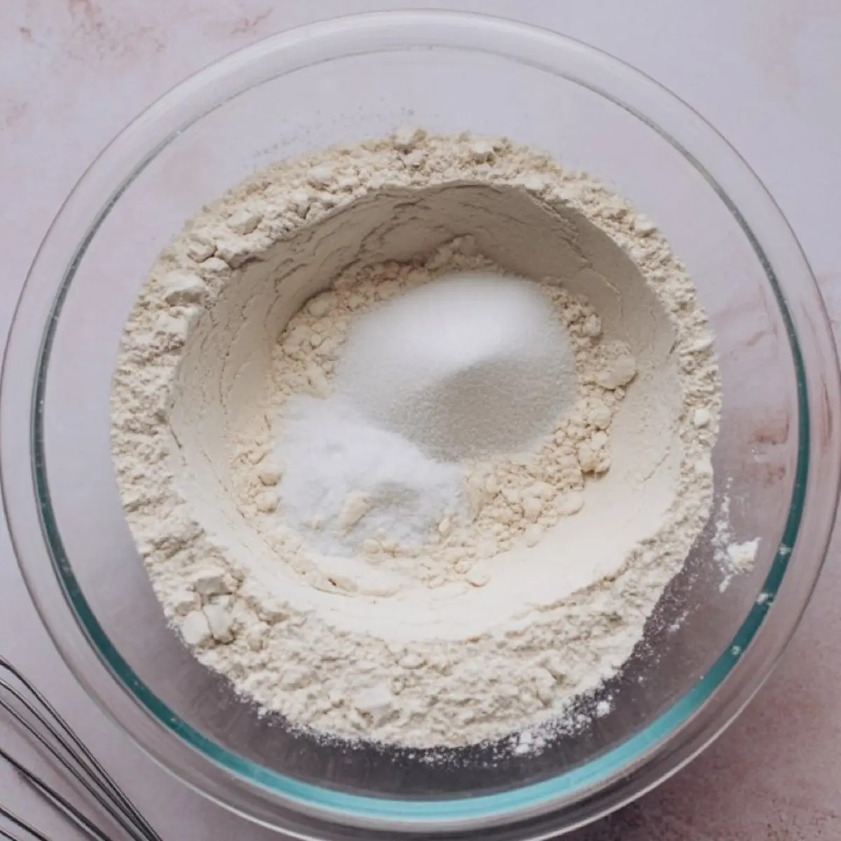 Flour mixture with well in center for quick banana bread batter - dry ingredients preparation for super moist banana bread recipe