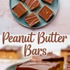Blue plate with squares of peanut butter bars topped with a shiny layer of chocolate, shown with a close-up of a sliced bar.