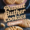 Plate of golden peanut butter cookies with text overlay reading “Peanut Butter Cookies – 3 Ingredient,” highlighting an easy homemade recipe.