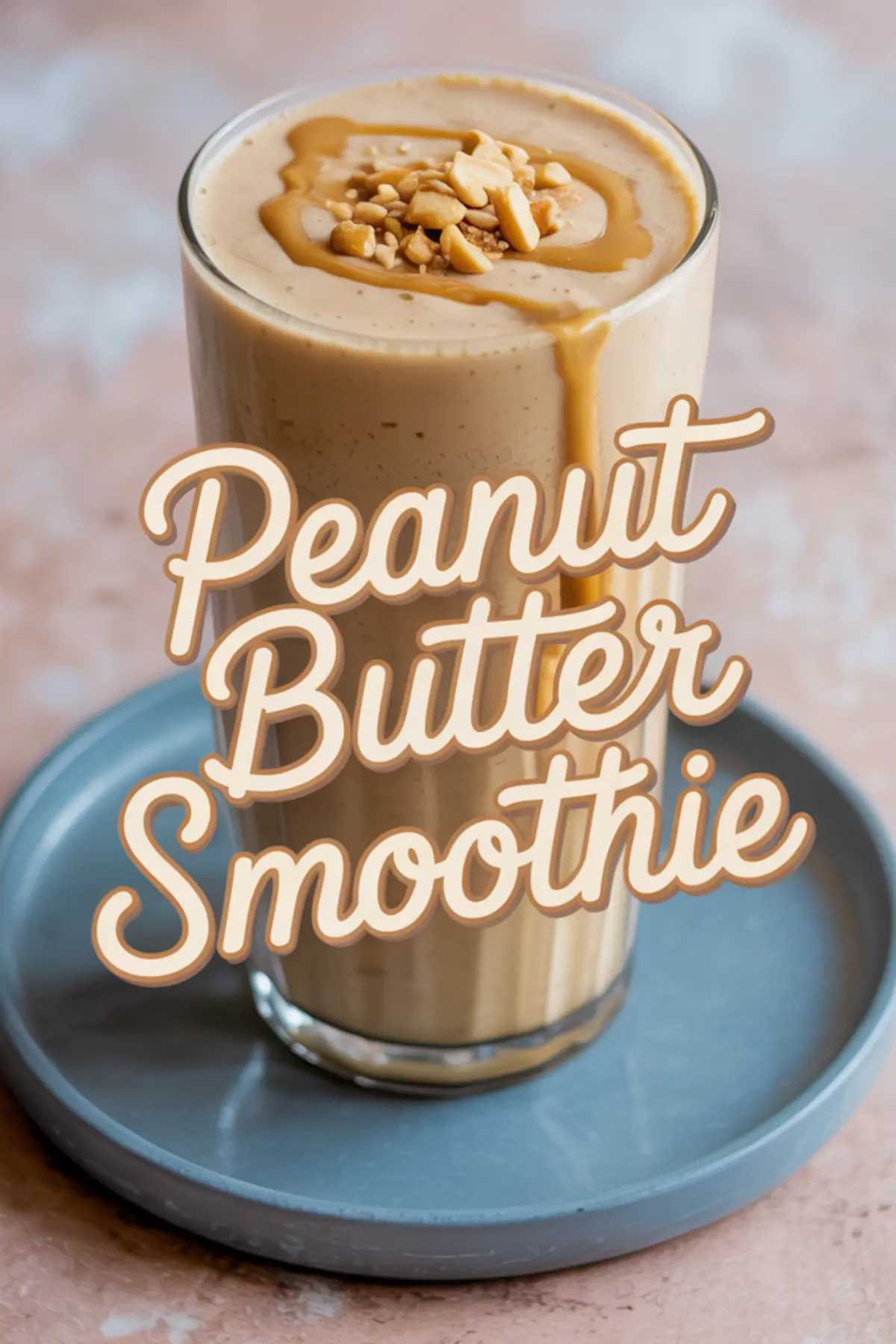 Tall glass of peanut butter smoothie topped with chopped peanuts and peanut butter drizzle, with bold text overlay reading “Peanut Butter Smoothie.”