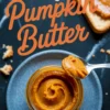 Spoonful of pumpkin butter being lifted from a glass jar on a gray plate, with a slice of toast in the background and text overlay reading “Easy Pumpkin Butter.”