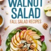 Fresh apple walnut salad plated with mixed greens, arranged red and green apple slices, blue cheese chunks, and whole walnuts, surrounded by fall-themed props and a mustard vinaigrette.