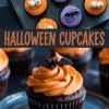 Chocolate Halloween cupcakes decorated with swirls of orange and purple frosting in a baking tray, topped with candy eyes and edible bat toppers. The bottom portion highlights a close-up cupcake with orange frosting and a bat decoration, styled as a festive Halloween treat.
