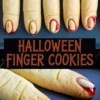 Halloween-themed almond finger cookies on a baking tray with realistic finger shapes, almond nails, and red jam at the tips, paired with spooky “Halloween Finger Cookies” text overlay in horror-style font.