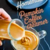 Homemade pumpkin coffee creamer being poured into a glass mug of coffee, with text overlay reading “Homemade Pumpkin Coffee Creamer.”