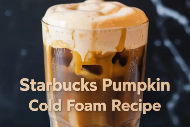 A tall glass of iced pumpkin cold foam coffee with creamy foam spilling over the rim, labeled as “Starbucks Pumpkin Cold Foam Recipe” in bold font over a black marble backdrop.