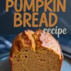 Sliced vegan pumpkin bread loaf on a gray plate with bold text overlay “Vegan Pumpkin Bread recipe,” showing a golden, tender crumb and lightly browned crust.