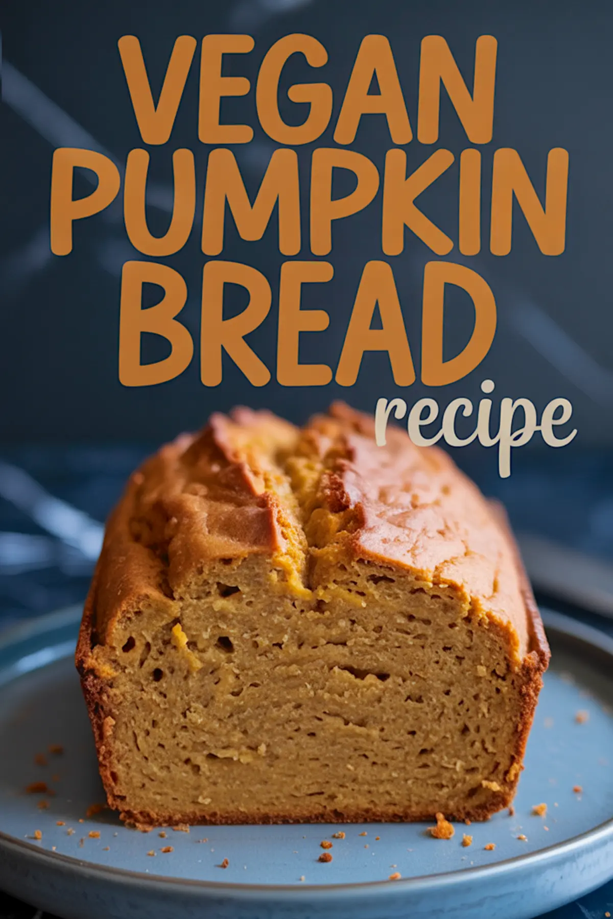 Sliced vegan pumpkin bread loaf on a gray plate with bold text overlay “Vegan Pumpkin Bread recipe,” showing a golden, tender crumb and lightly browned crust.