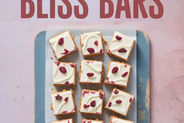 Top view of sliced cranberry bliss bars arranged on a parchment-lined tray, topped with smooth white chocolate frosting and dried cranberries. Text overlay highlights the dessert name for easy Pinterest recognition.