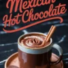 Steaming cup of Mexican hot chocolate with a swirl of frothy chocolate on top and two cinnamon sticks, served on a round tray with chocolate discs and cinnamon on the side, with bold text “Mexican Hot Chocolate”.