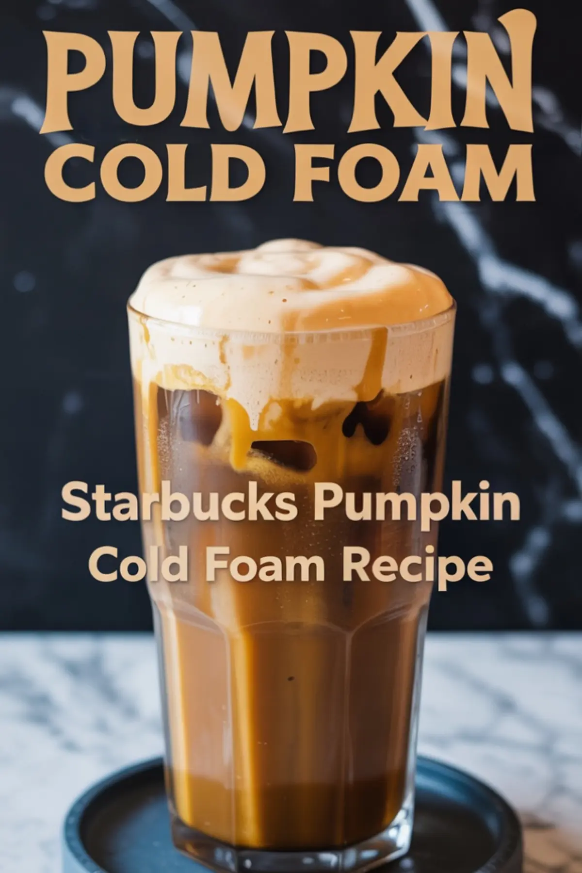 A tall glass of iced pumpkin cold foam coffee with creamy foam spilling over the rim, labeled as “Starbucks Pumpkin Cold Foam Recipe” in bold font over a black marble backdrop.
