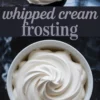 A swirl of whipped cream frosting fills a white ramekin, with a spoonful of frosting above and bold text reading “whipped cream frosting” across the center.