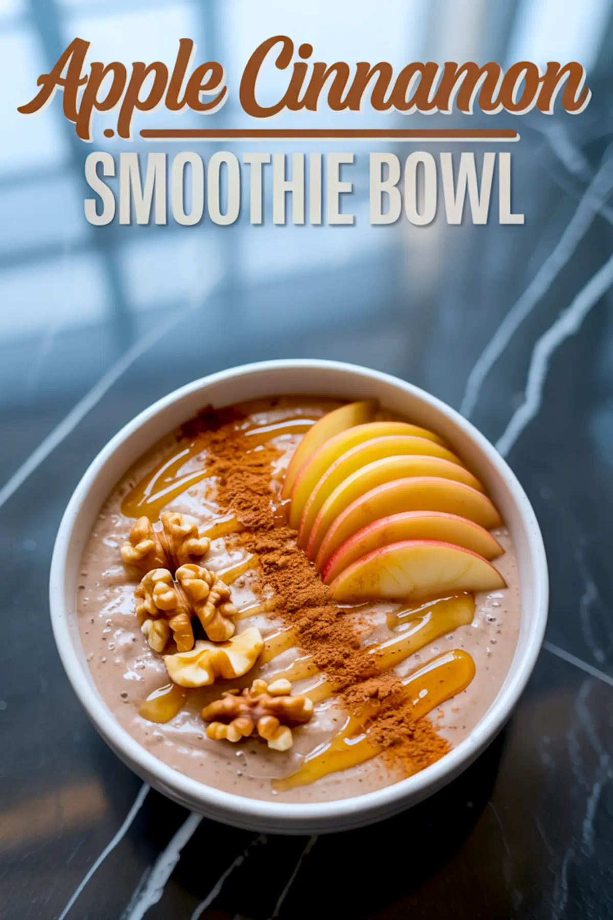 Apple cinnamon smoothie bowl garnished with fresh apple slices, whole walnuts, cinnamon powder, and golden honey drizzle, with text overlay reading “Apple Cinnamon Smoothie Bowl.”