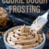 Vertical image of a white bowl filled with piped cookie dough frosting topped with chocolate chips, accompanied by a metal spatula, with bold text “Cookie Dough Frosting” above and cupcakes in the background.