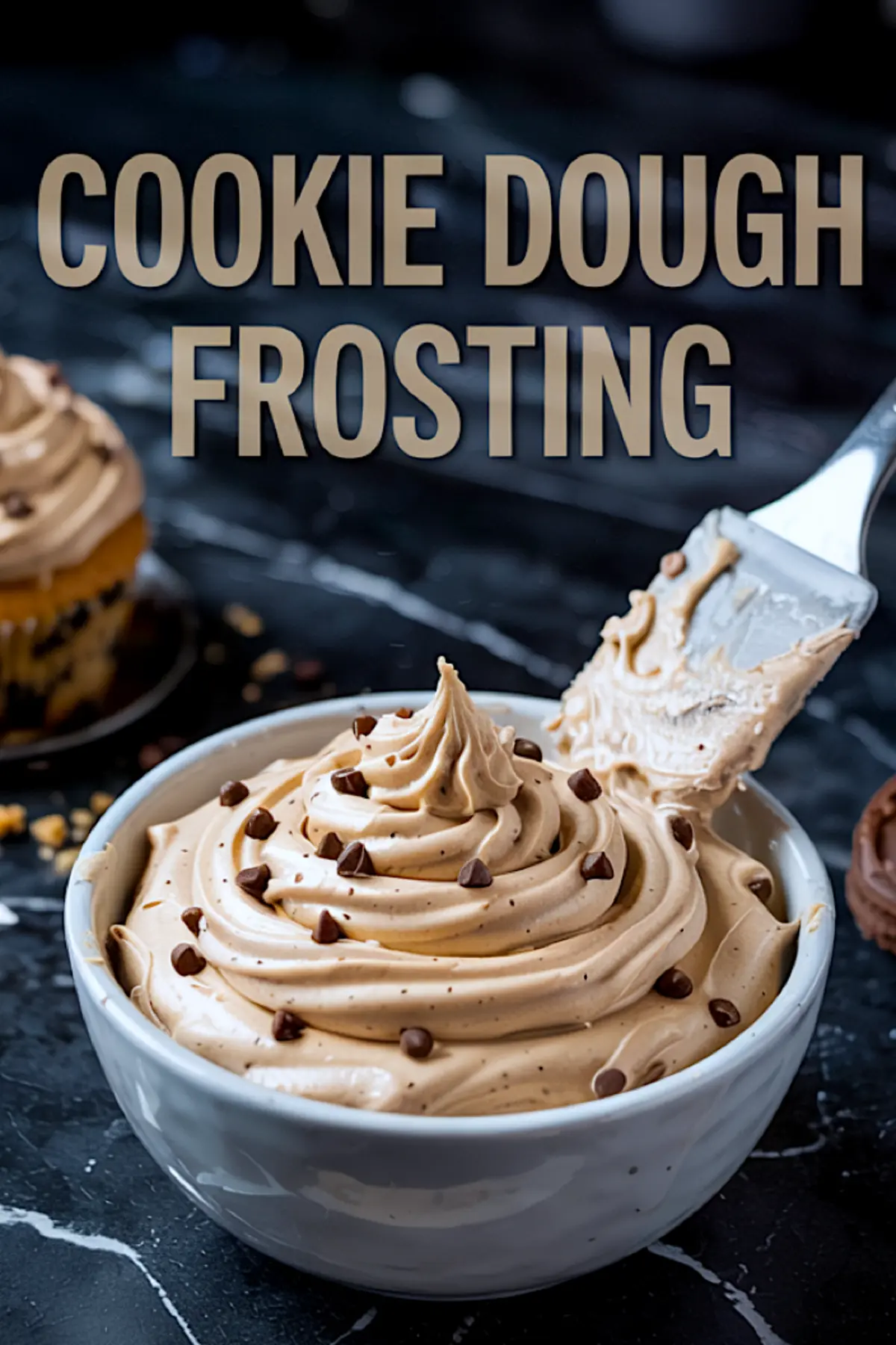 Vertical image of a white bowl filled with piped cookie dough frosting topped with chocolate chips, accompanied by a metal spatula, with bold text “Cookie Dough Frosting” above and cupcakes in the background.