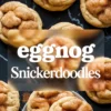 Eggnog snickerdoodle cookies topped with cinnamon sugar, styled on a dark marble surface with a blurred text overlay for recipe promotion or holiday baking pin.