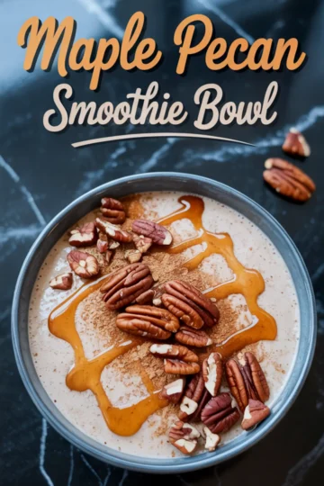 Maple pecan smoothie bowl topped with whole pecans, a drizzle of maple syrup, and dusted cinnamon, presented on a dark marble background with bold title text.