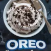 Collage image showing a bowl of Oreo frosting swirled with crushed cookies and a metal spatula beside it, paired with cupcakes decorated with Oreo buttercream and text overlay “Oreo Frosting.”