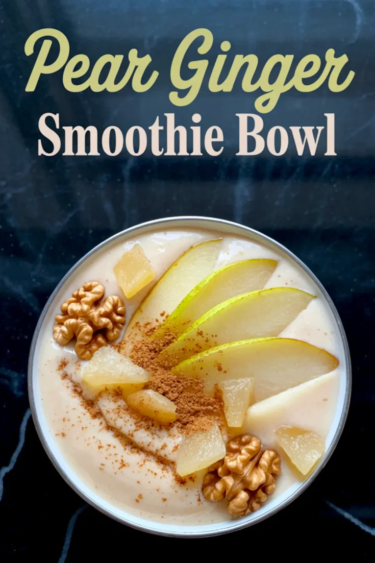 Overhead shot of a pear ginger smoothie bowl garnished with sliced pear, cinnamon, pineapple chunks, and whole walnuts on a black marbled background, with a title text overlay.